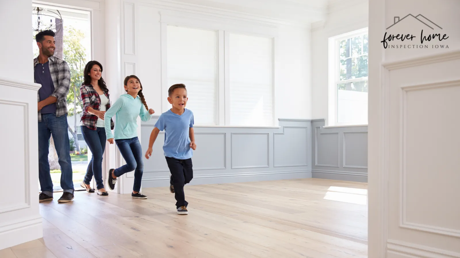 Family walking into a bright, empty new home