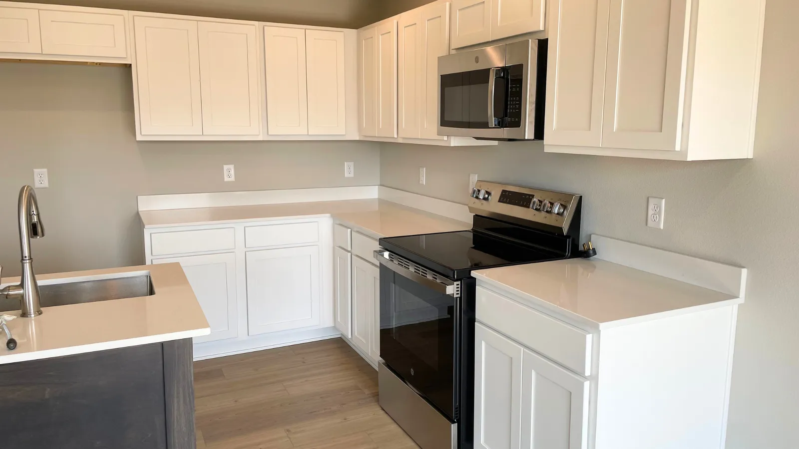 Kitchen with white cabinets and stainless appliances