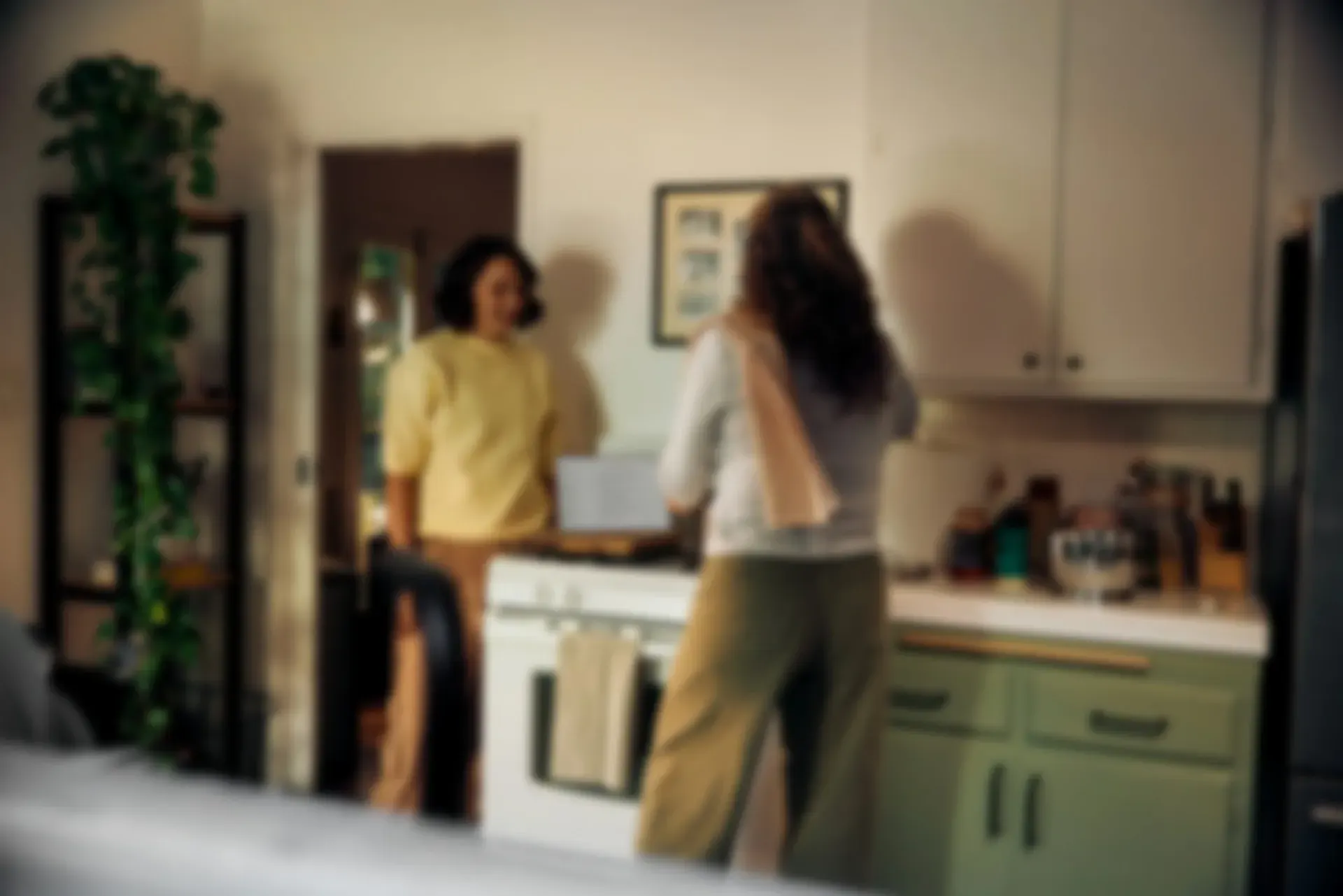Couple standing together in a warm, welcoming kitchen