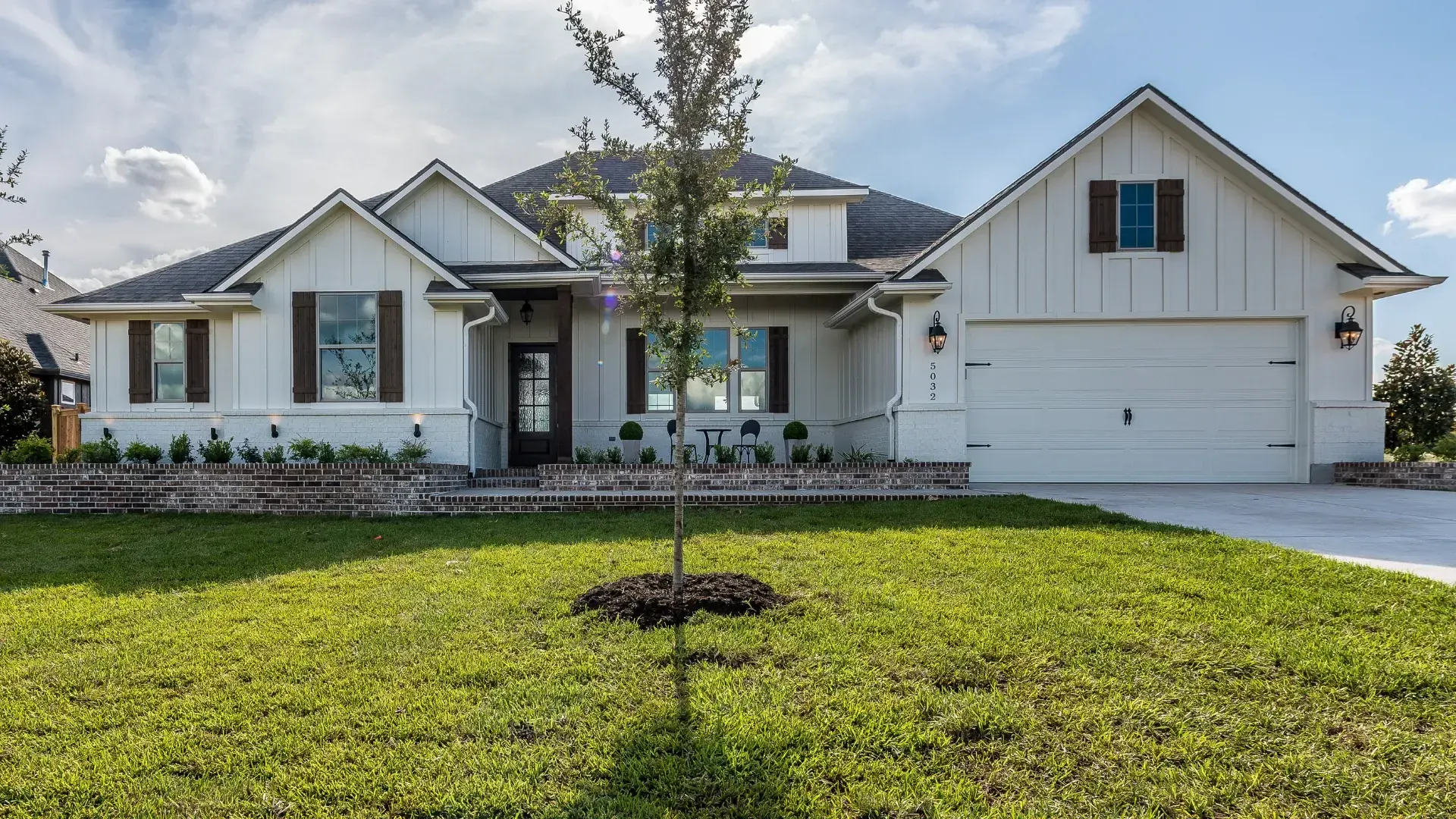 Bright white farmhouse-style new build home