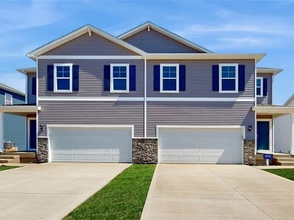Grey duplex with navy shutters