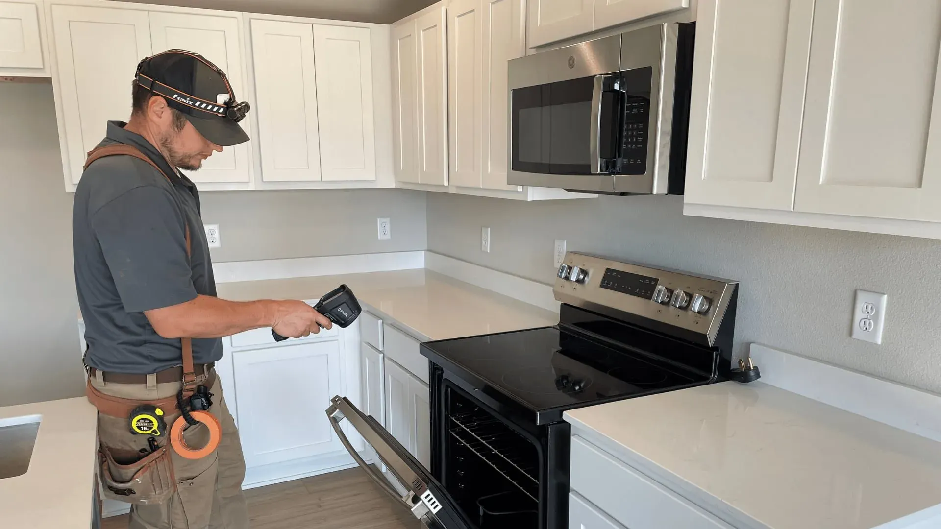 Matt scanning a new kitchen with a thermal camera
