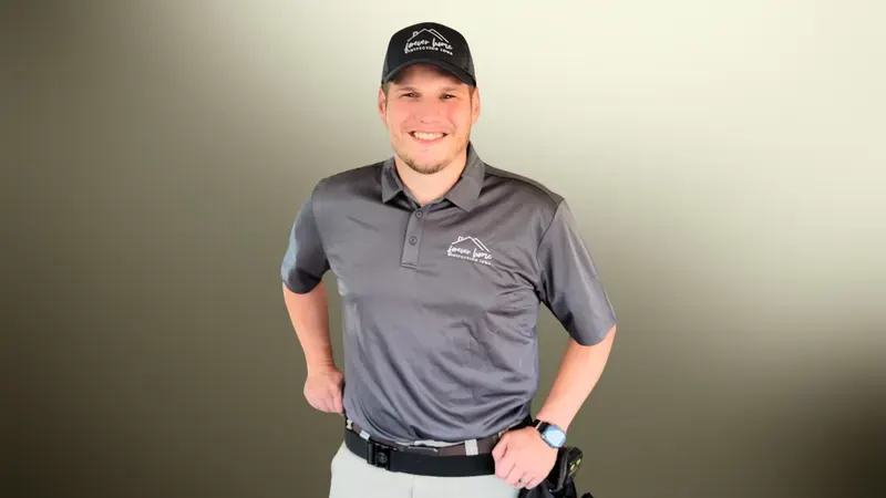 Forever Home Inspection inspector in a grey company polo and cap, smiling